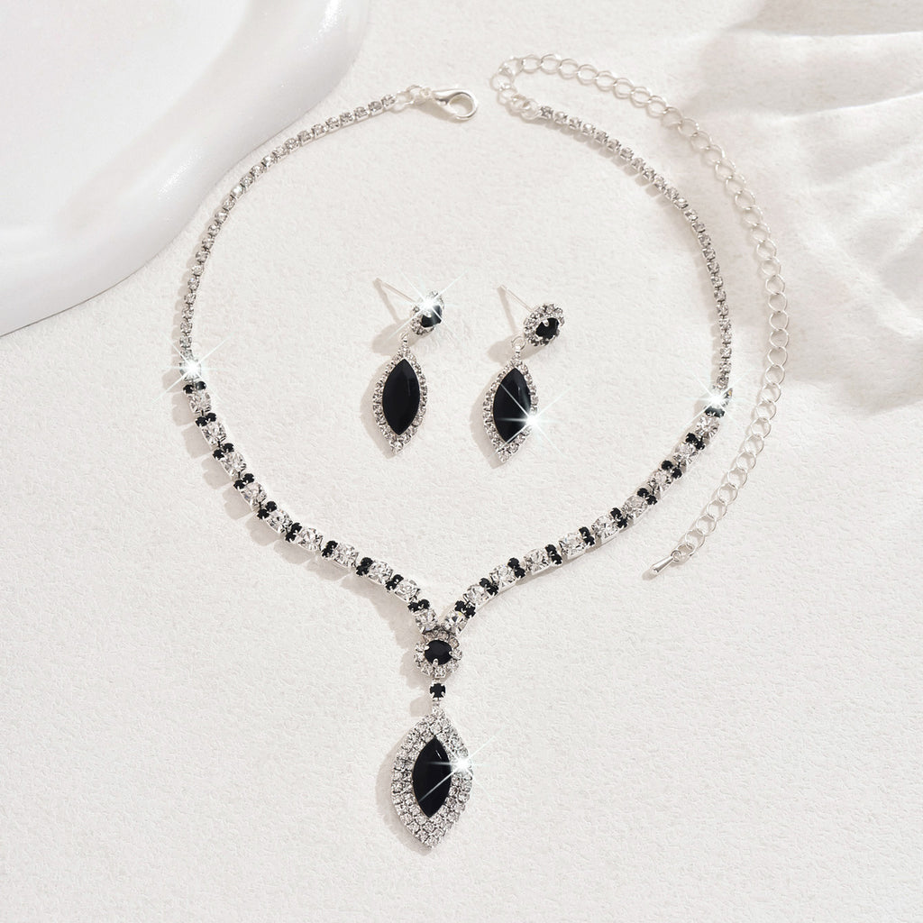 Teardrop Rhinestone Necklace and Earrings Set, Claw Chain Design — shown in use