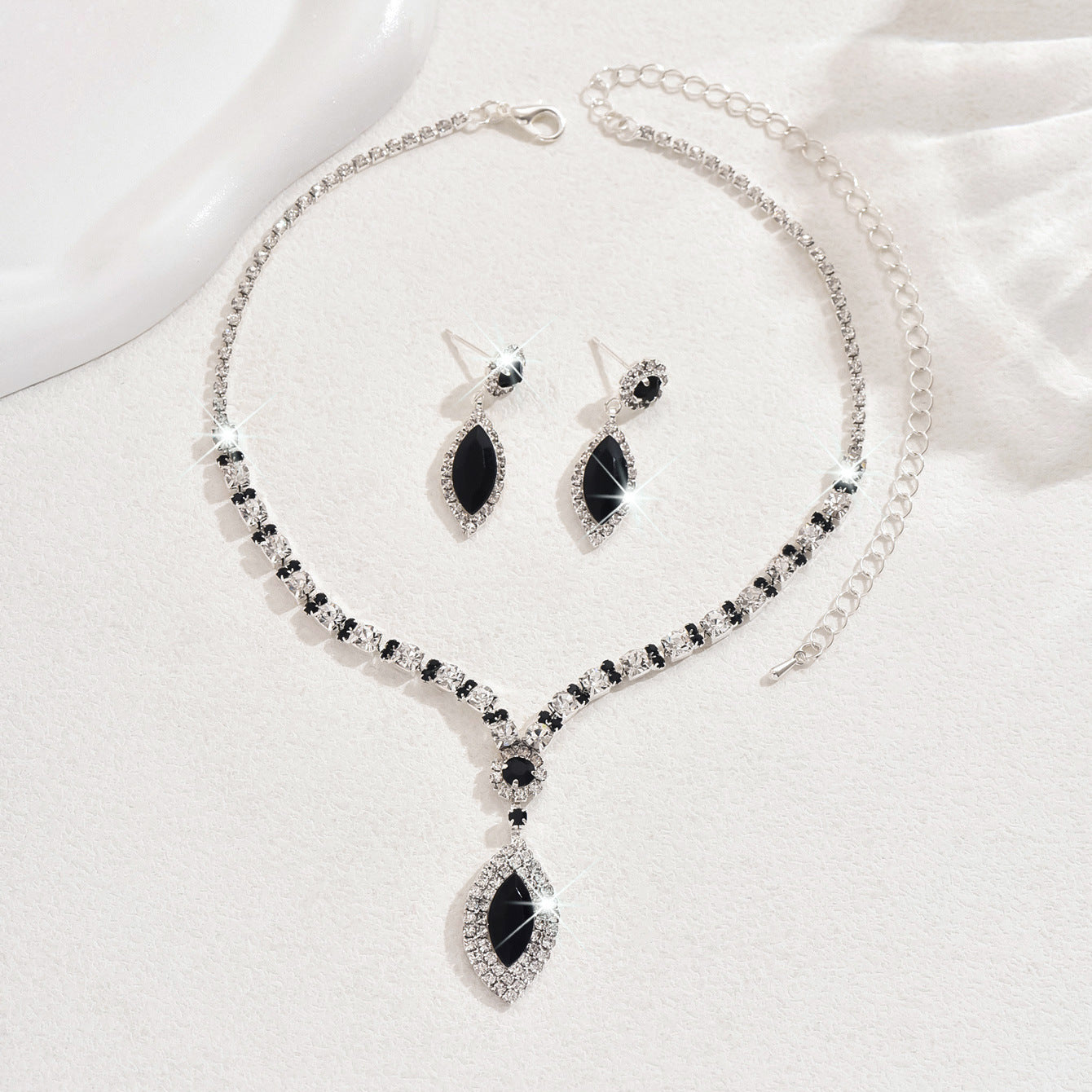 Teardrop Rhinestone Necklace and Earrings Set, Claw Chain Design — shown in use