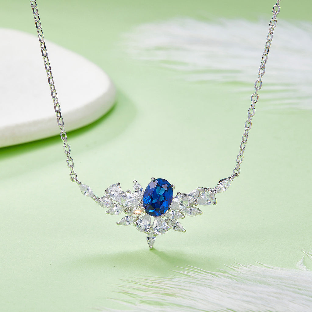 Sterling Silver Lab-Grown Ruby or Sapphire Necklace, 8x6mm Oval with Marquise Cluster — shown in use