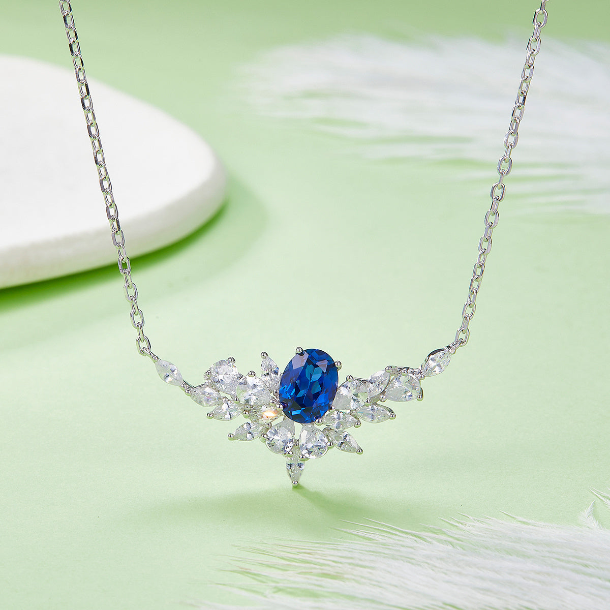 Sterling Silver Lab-Grown Ruby or Sapphire Necklace, 8x6mm Oval with Marquise Cluster — shown in use