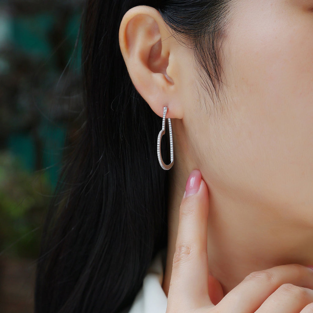 Sterling Silver Open Heart Hoop Earrings With 44 Pave Moissanite Stones, D-VVS1 — shown in use