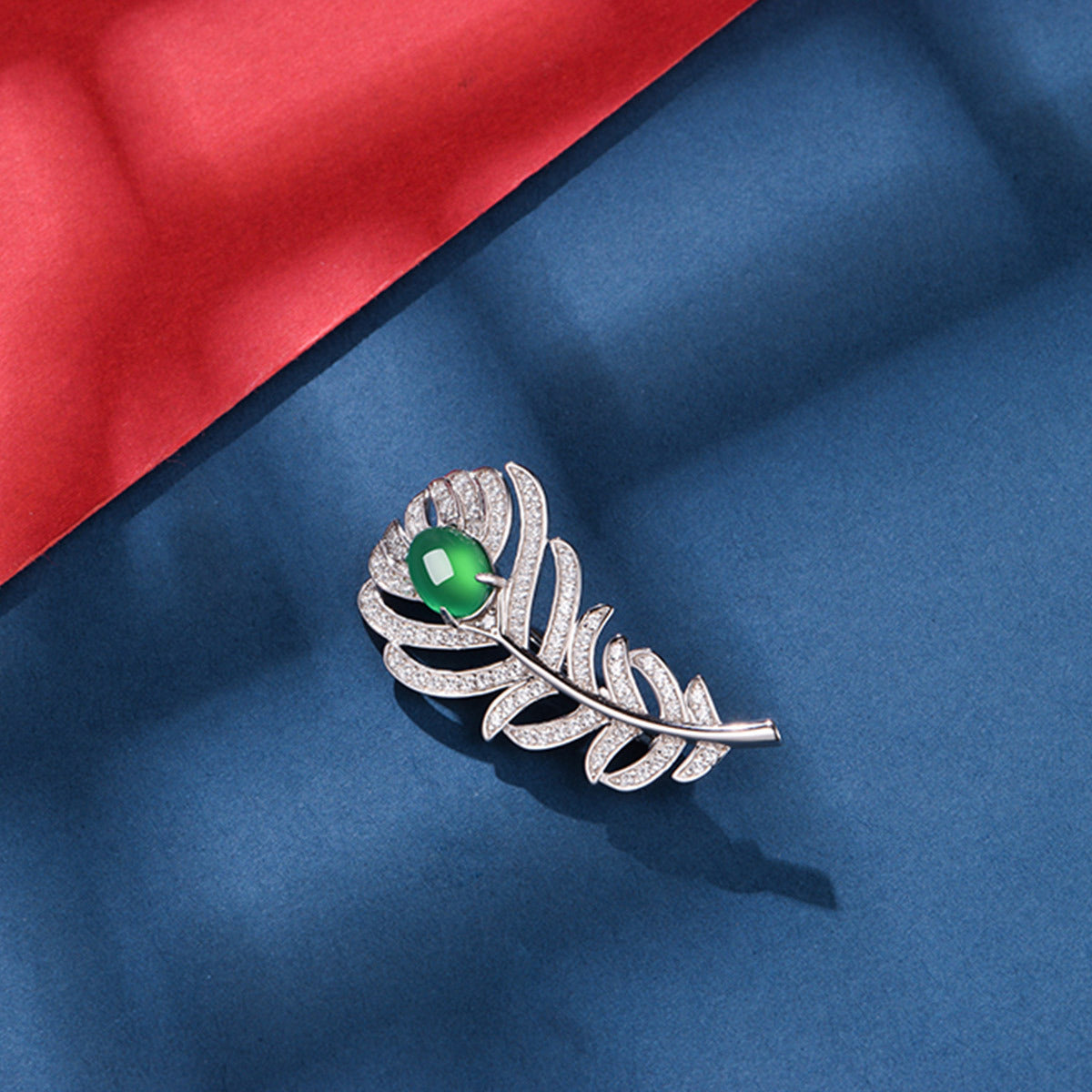 Sterling Silver Feather Brooch With 8 x 6 mm Green Chrysoprase Cabochon, Platinum-Plated — detail close-up