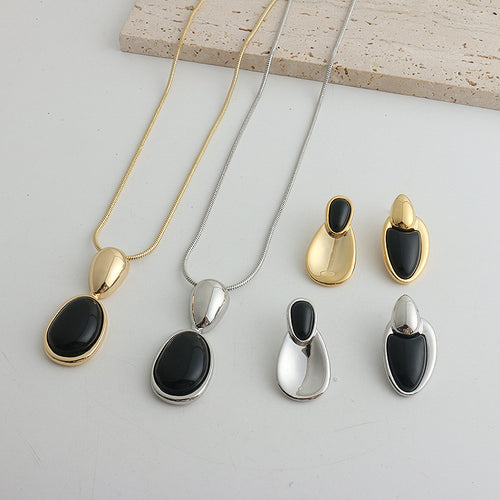 Black Onyx Necklace or Earrings in Gold or Silver Tone, Irregular Stitched Design — front view