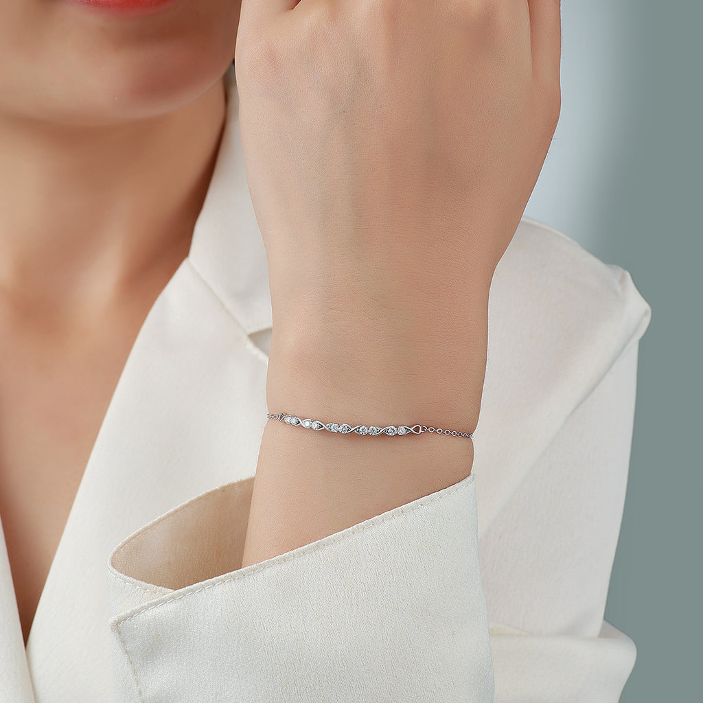 Sterling Silver Infinity Bracelet With Moissanite, D-VVS1 — shown in use