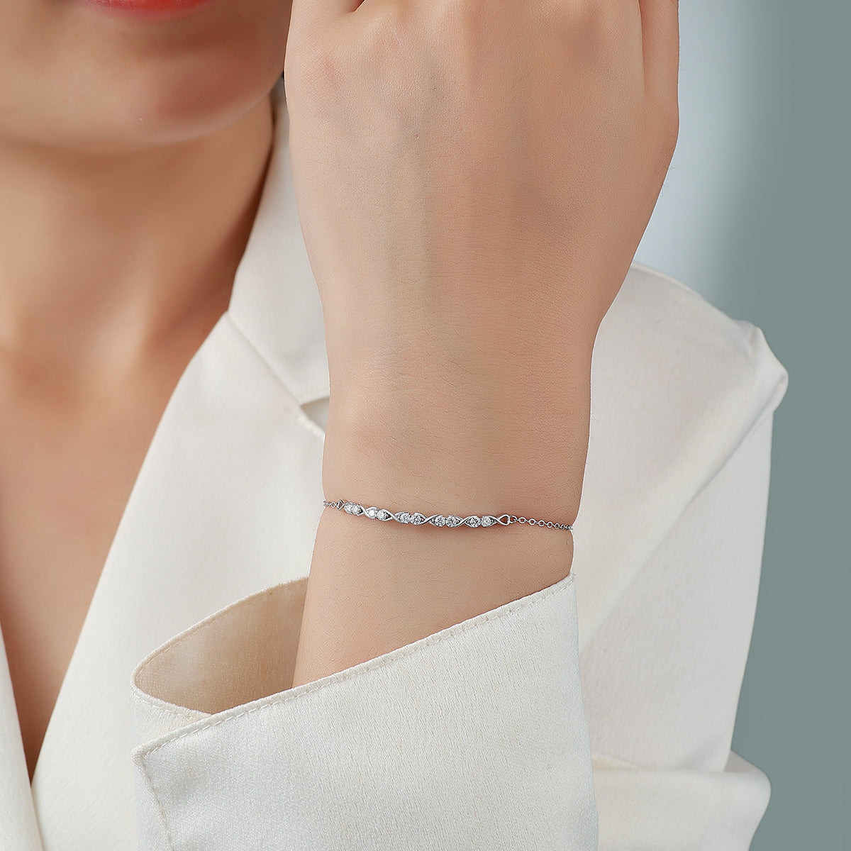 Sterling Silver Infinity Bracelet With Moissanite, D-VVS1 — shown in use
