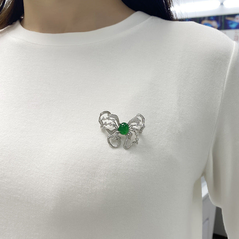 Sterling Silver Butterfly Brooch With 8 x 10 mm Green Chrysoprase Cabochon, Platinum-Plated — detail close-up
