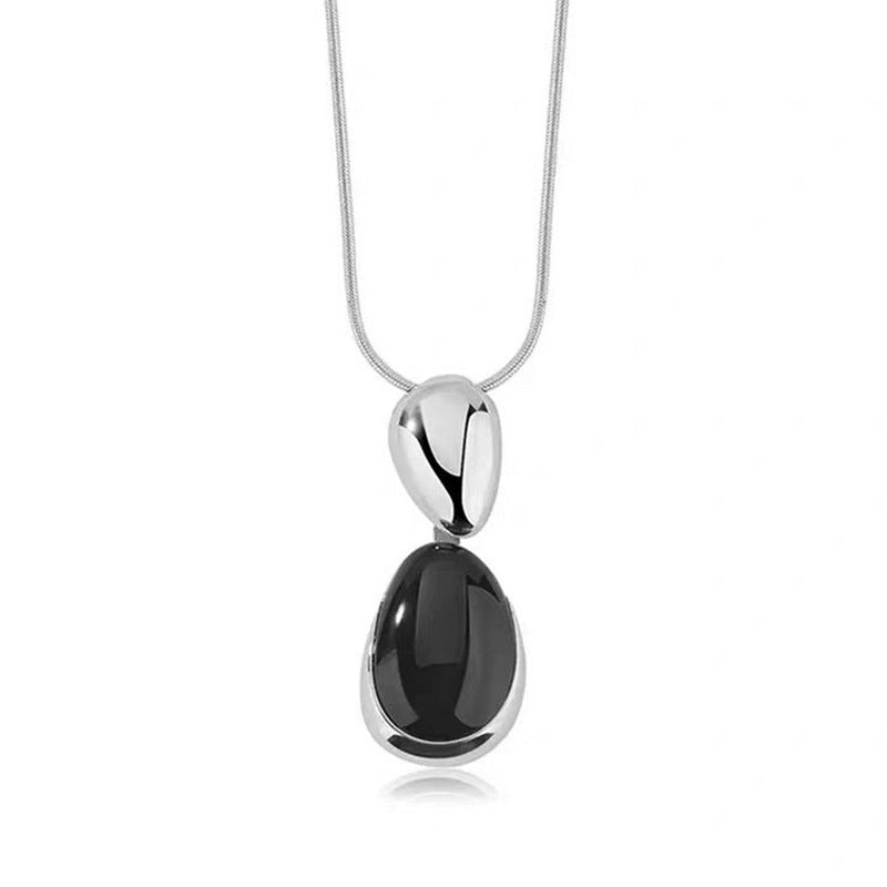 Black Onyx Necklace or Earrings in Gold or Silver Tone, Irregular Stitched Design — shown in use